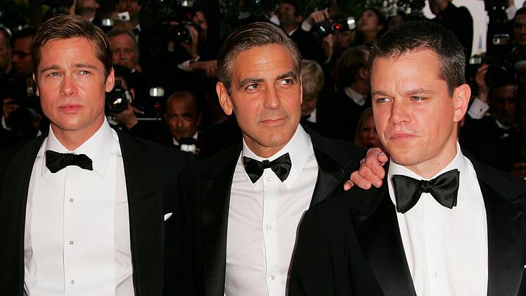 Auch Matt Damon (rechts) und Brad Pitt (links) sind neben George Clooney in "Ocean's 14" dabei.
