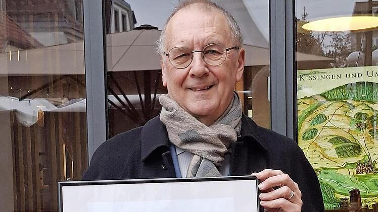 Ulrich Kutz mit Ehrenurkunde.