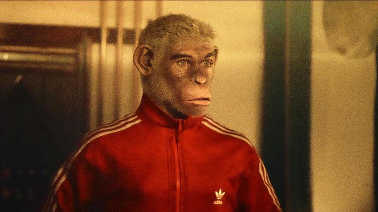 Durchaus beeindruckend: Man kann Robbie Williams an der Trainingsjacke und der K&ouml;rperhaltung gut erkennen, auch wenn er hier als Affe dargestellt ist.
