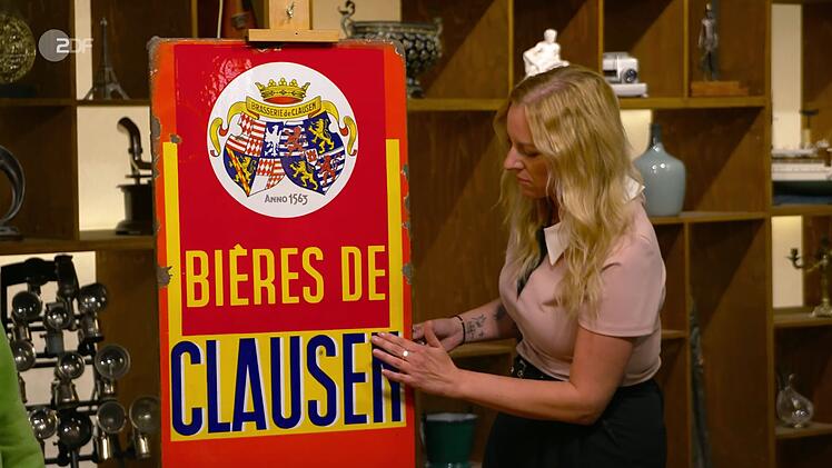 Auch Expertin Annika Raßbach kannte sich schon lange mit Retro- und Vintageobjekten aus. Bei dem Schild "Bières de Clausen" der Luxemburger Brauerei fiel ihr vor allem "das wunderschöne Motiv" auf. Zudem erzählte sie, dass es sich um eine der ältesten Brauereien des Landes handelte: 1563 gegründet, aber leider 1971 eingestellt.