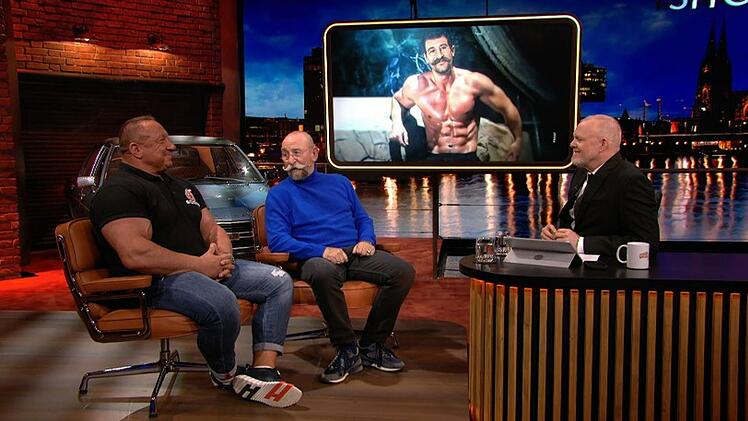 "Bares für Rares"-Moderator Horst Lichter (Mitte) hat bei Stefan Raab über seine Bodybuilder-Vergangenheit gesprochen.