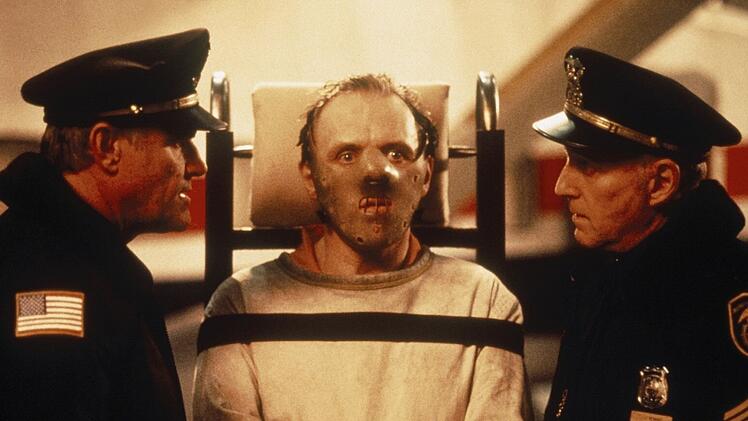 Als kannibalistischer, aber hochintelligenter Psychopath Dr. Hannibal Lecter schockte und begeisterte Anthony Hopkins (Mitte) in Jonathan Demmes Meisterwerk "Das Schweigen der Lämmer" Publikum und Kritiker.