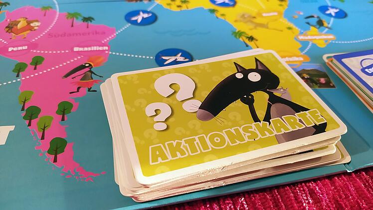 Reise um die Welt mit Wolf - Rezension des Postkarten-Brettspiels für Kinder