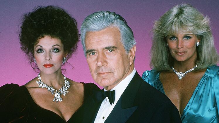 Weltber&uuml;hmt wurde John Forsythe mit der Rolle des &Ouml;l-Magnaten Blake Carrington an der Seite von Joan Collins (links) und Linda Evans in dem Soap-Klassiker "Denver Clan".