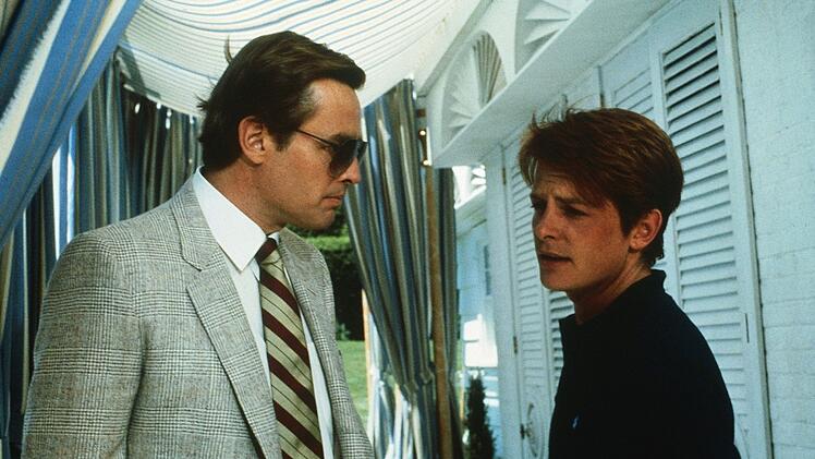Mit List und T&uuml;cke trickst Brantley (Michael J. Fox) seinen Boss Prescott (Richard Jordan) aus und &uuml;bernimmt seinen Job.