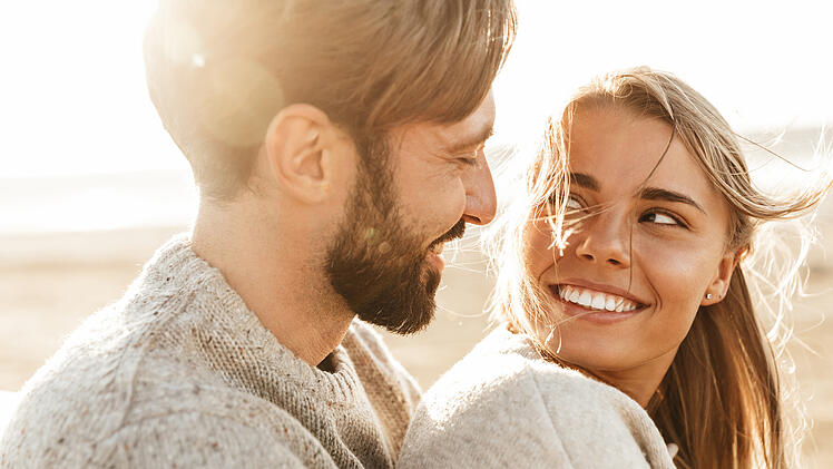 Close up of a smiling beautiful young couple