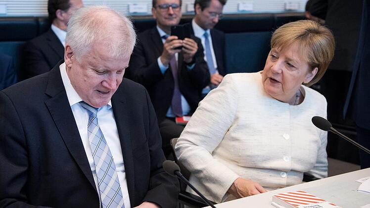 Horst Seehofer und Angela Merkel.  Foto: Kay Nietfeld/dpa