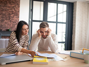 Husband feeling overloaded while filling tax declaration with wife