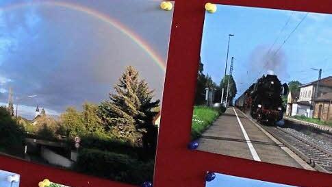 Ob die historische Dampflok am Bahnhof oder der Regenbogen über der Unterführung: Der Fotograf hat genau den richtigen Moment festgehalten.