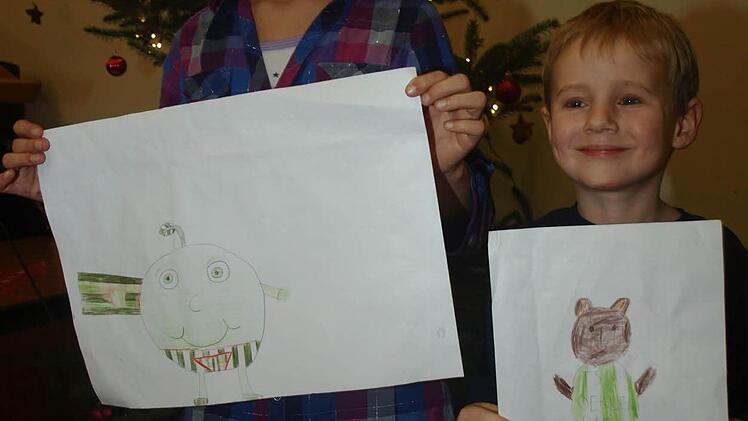 Aileen Johannes malte den Apfelball, Marlon Kuhn den Bären. Beide Bilder wurden zu einem vereint.