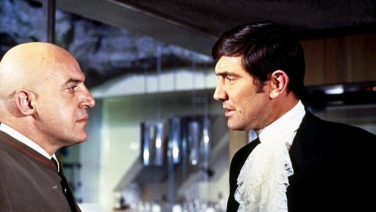 "Im Geheimdienst Ihrer Majestät" (1969) blieb der einzige Bond-Auftritt von George Lazenby (Bild, rechts, mit Telly Savalas).