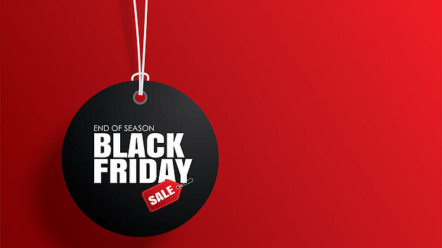 Black friday sale tag circle banner and the rope hanging on red background