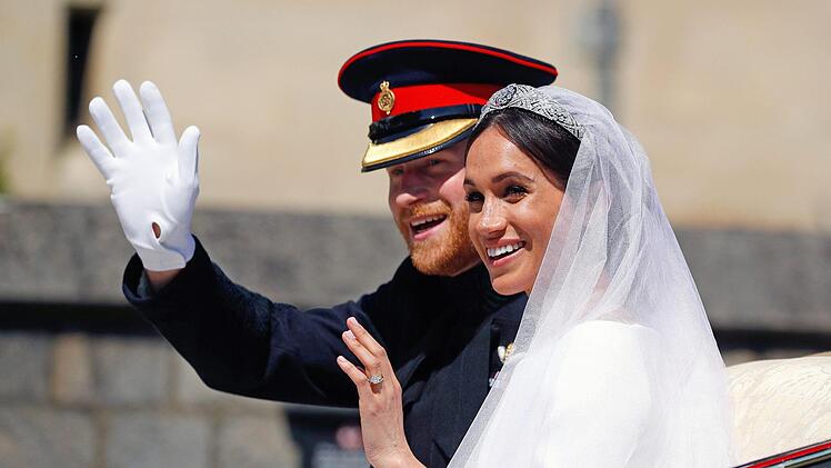 Prinz Harry und seine Frau Meghan. Foto: Phil Noble/AP/dpa