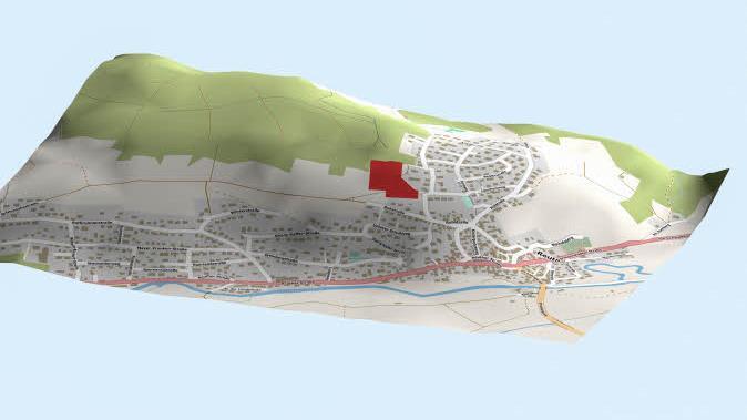 Die 3D-Grafik zeigt den Stadtteil Reuth von Süden aus, das neue Baugebiet ist rot gekennzeichnet.  3D-Grafik: Micho Haller