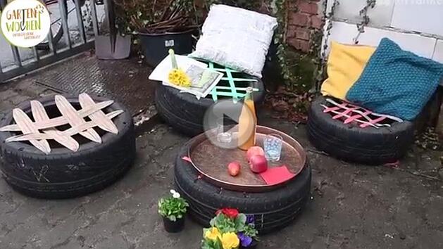 Sitzgelegenheiten für den Garten - in unserem Video zeigen wir, wie man aus Autoreifen günstig und einfach Hocker für draußen bauen kann. Foto: Screenshot / Ronald Rinklef