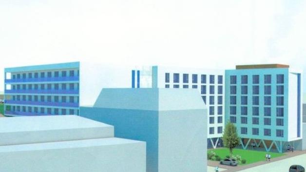 Der denkmalgeschützte Darrturm ist hinter dem Megagebäude kaum mehr zu sehen. Visualisierung: Drösel-Gruppe