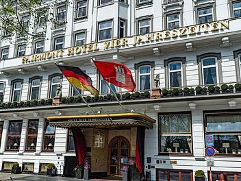 Famous Hotel Four Seasons Hotel in Hamburg called Vier Jahreszeiten - HAMBURG, GERMANY - MAY 10, 2021