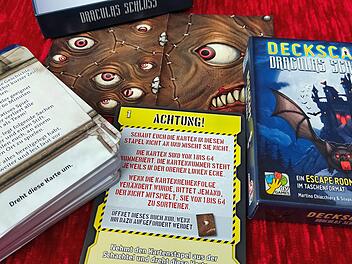 Deckscape - Draculas Schloss - Rezension des Escape-Room-Kartenspiels