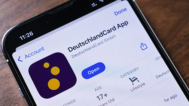 Poznan, Poland - March 26, 2025: Close-up of a phone screen displaying the DeutschlandCard app, used for collecting points, redeeming rewards, and managing loyalty programs at partner stores