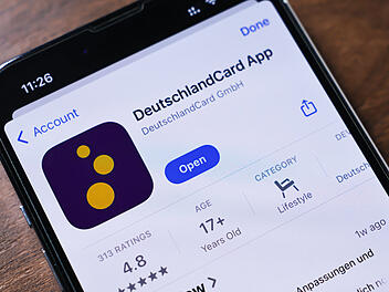 Poznan, Poland - March 26, 2025: Close-up of a phone screen displaying the DeutschlandCard app, used for collecting points, redeeming rewards, and managing loyalty programs at partner stores