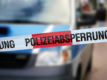 Police cordon tape with the german word &acirc;&euro;žPolizeiabsperrung&acirc;&euro;&oelig;