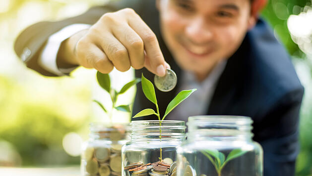 Finance broker demonstrating investment and savings growth