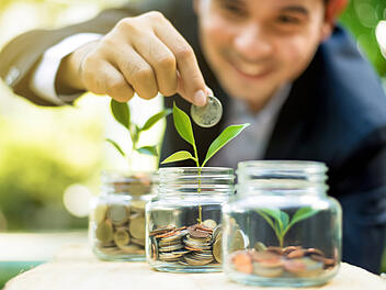 Finance broker demonstrating investment and savings growth