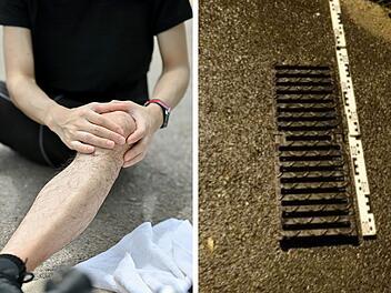 Radfahrer in Nürnberg über Regenrinnenabdeckung gestützt Radfahrer in Nürnberg über Regenrinnenabdeckung gestützt