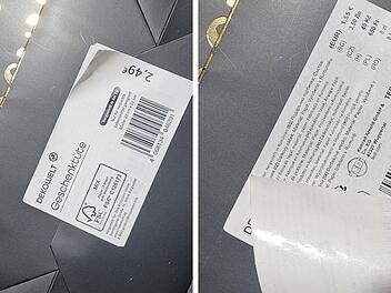 Zwei Preisschilder auf einer Geschenkt&uuml;te &uuml;berkleben sich. Der obere Preis betr&auml;gt 2,49&euro;, darunter ist ein weiteres Schild mit 1,55&euro;. Ein "bedauerlicher Fehler" laut Rossmann.