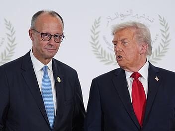 "Er versucht es nicht mit Unterwerfung": Friedrich Merz (links) wei&szlig; Donald Trump offenbar zu nehmen.