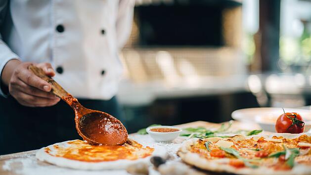 Fresh Italian pizza making process.