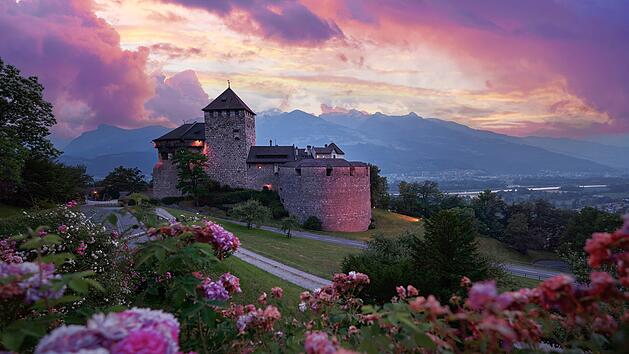 Vaduz Royal castle in Liechtenstein. Scenic landscape of old medieval castle in Alps mountains in summer. Beautiful view of Alpine nature.