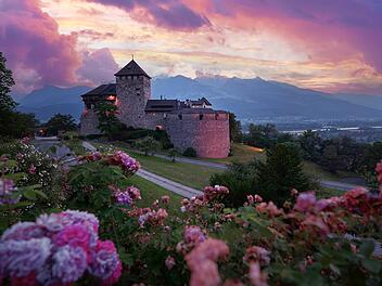Vaduz Royal castle in Liechtenstein. Scenic landscape of old medieval castle in Alps mountains in summer. Beautiful view of Alpine nature.